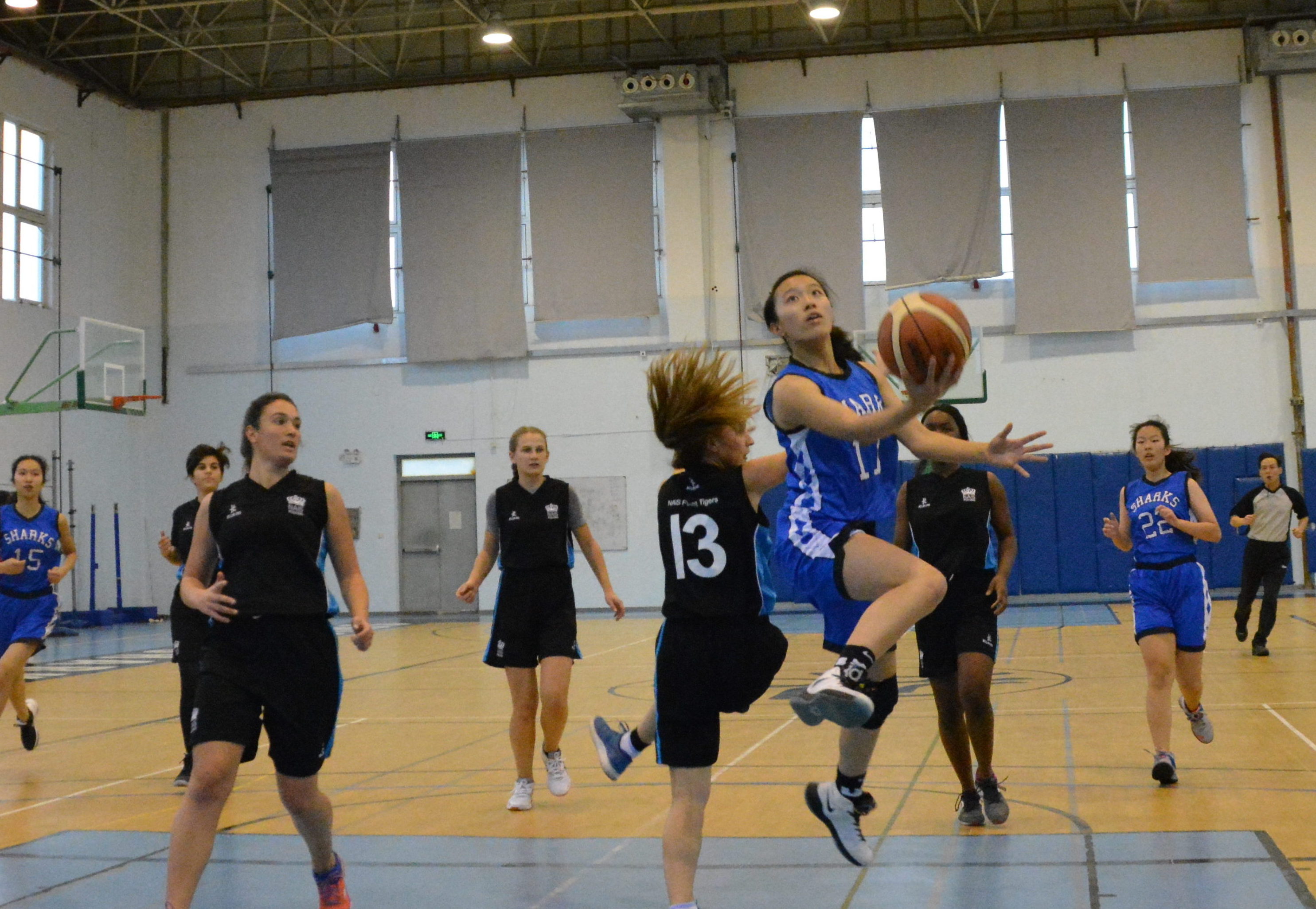 Sophie Chao flies through the lane for a layup